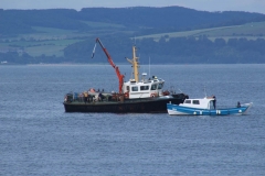 A member's boat having a close encounter with MV Conserver