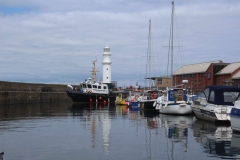 View of the pontoons and old lighthouse, which is the unmistakeable feature at the harbour entrance